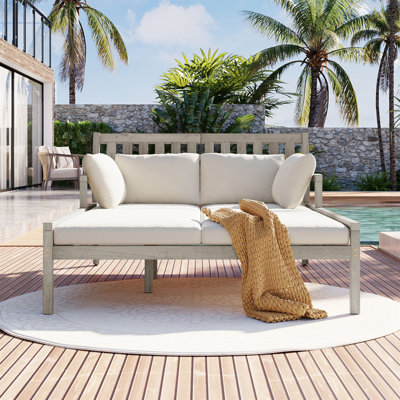 Outdoor Wooden Chaise Lounge With Comfortable Armrests And Four Pillows For Relaxation