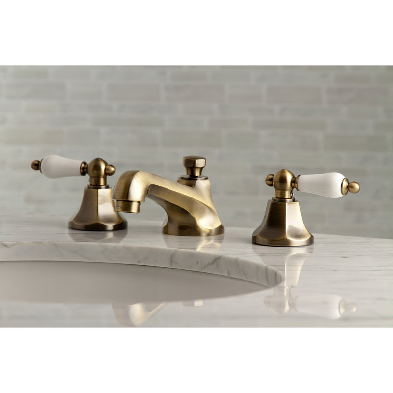 Kingston Brass Metropolitan Two-Handle 3-Hole Deck Mount Widespread Bathroom Faucet with Brass Pop-Up Drain, Antique Brass