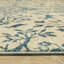Tapis floral en polypropylène tissé à la machine en ivoire / bleu Kovac-1560817982