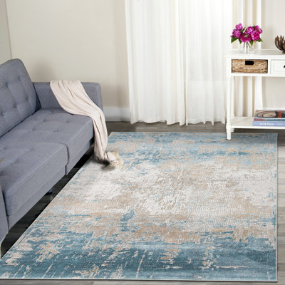 Tapis abstrait doré / bleu Brazell