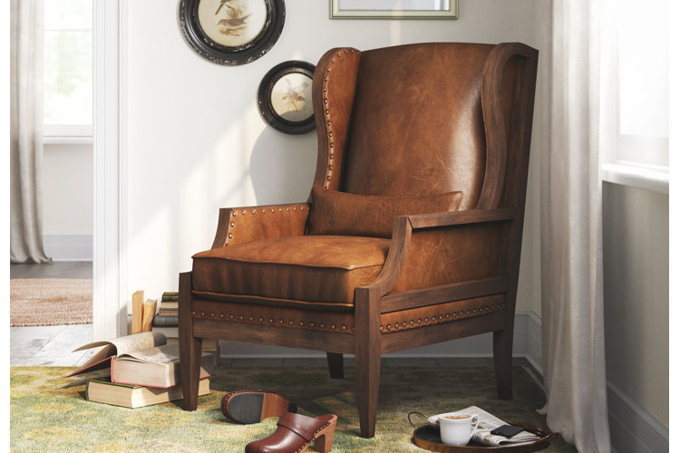 comfortable leather armchair with nailhead trim and rolled arms