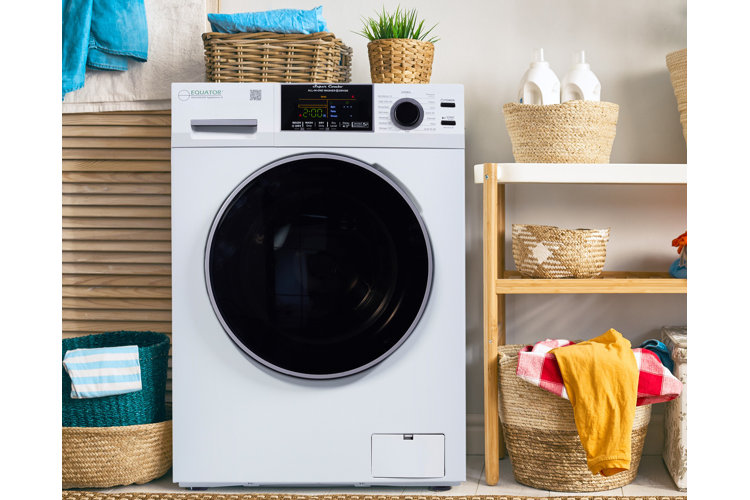 laundry room with white tumble dryer. Wooden shelves with various woven baskets for holding laundry accessories, detergents, and clothing