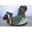 Statue en bronze fille Selene portant un chapeau allongé sur le ventre - Taille: L 33 po x l 17 po x H 17 po.