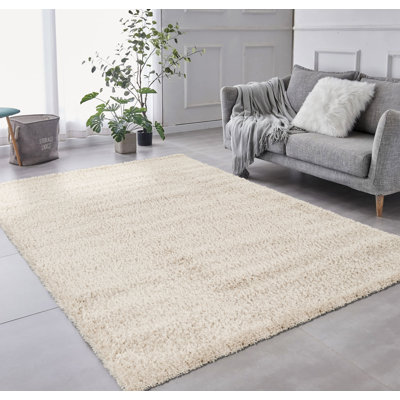 Tapis lavable moderne beige uni à poils longs