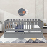 A Wooden Twin-Sized Daybed With Fence-Style Guardrails And Two Integrated Drawers