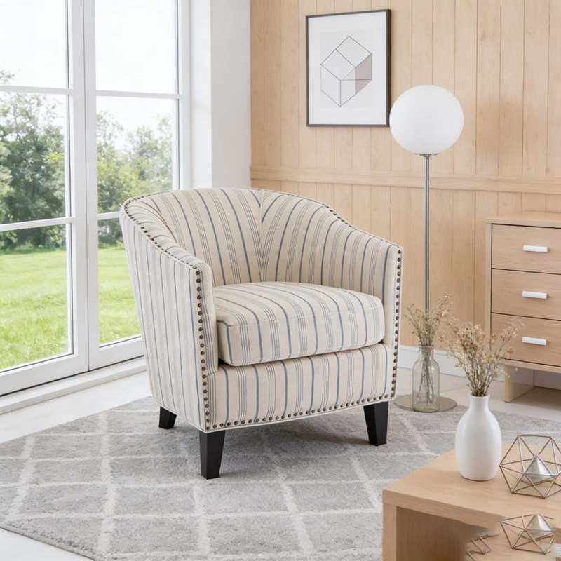 Fauteuil demi-tonneau rembourré à rayures