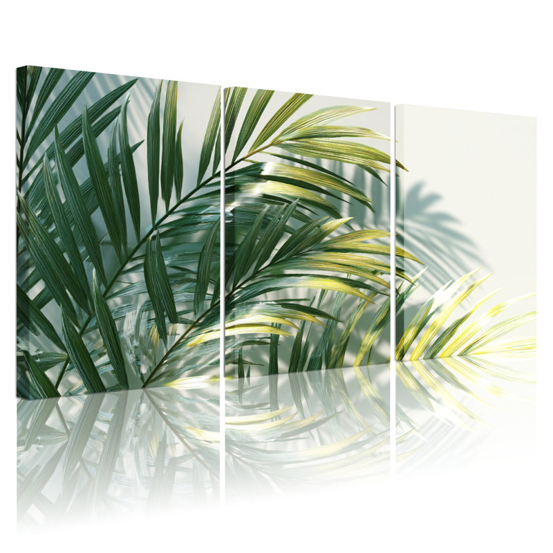 Ensemble de 3 tableaux sur toile tendue représentant des feuilles de palmier tropicales et reflétant la nature