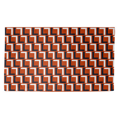 Tapis géométrique rouille / noir / blanc