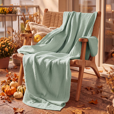 Bedsure 100% Cotton Muslin Blanket, 4-Layer Lightweight Gauze Blanket for Dorm, Couch & All-Season Comfort