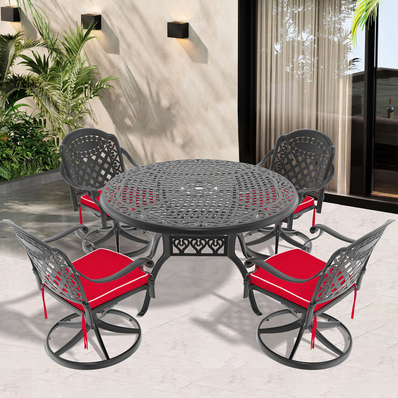 L'ensemble de salle à manger toutes saisons en fonte d'aluminium comprend 4 chaises pivotantes et une table ronde de 48,03 po avec cadre noir 