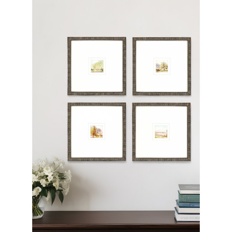 Ensemble de quatre petites reproductions d'art encadrées dorées au lever du soleil