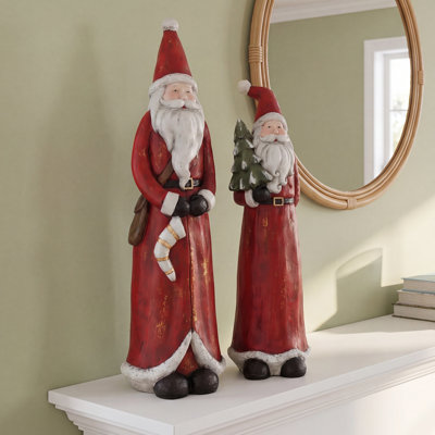 SET OF TWO RESIN SANTAS