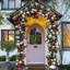 Couronne de vigne de Noël - vert / rouge - couronne de porte d'entrée avec clochettes et baies pour décoration de maison de vacances