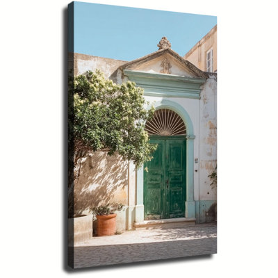 Photographie d'une vieille porte italienne vintage en bois vert et pierre, imprimée sur toile tendue sur châssis, idéale pour le salon ou la chambre.