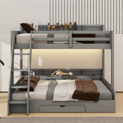 Lit superposé simple au-dessus d'un lit double avec tablettes de rangement, éclairage à DEL et tiroir pratique