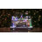 16" White and Brown LED Lighted and Animated Christmas Village with Flying Sleigh Tabletop Decor