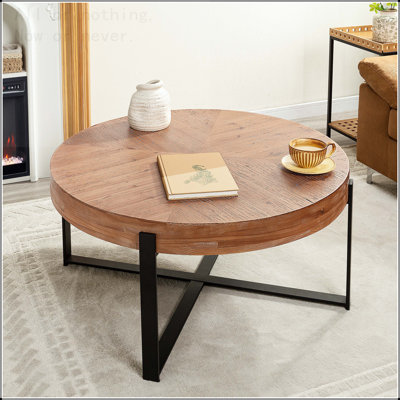 Table basse ronde moderne avec pieds croisés