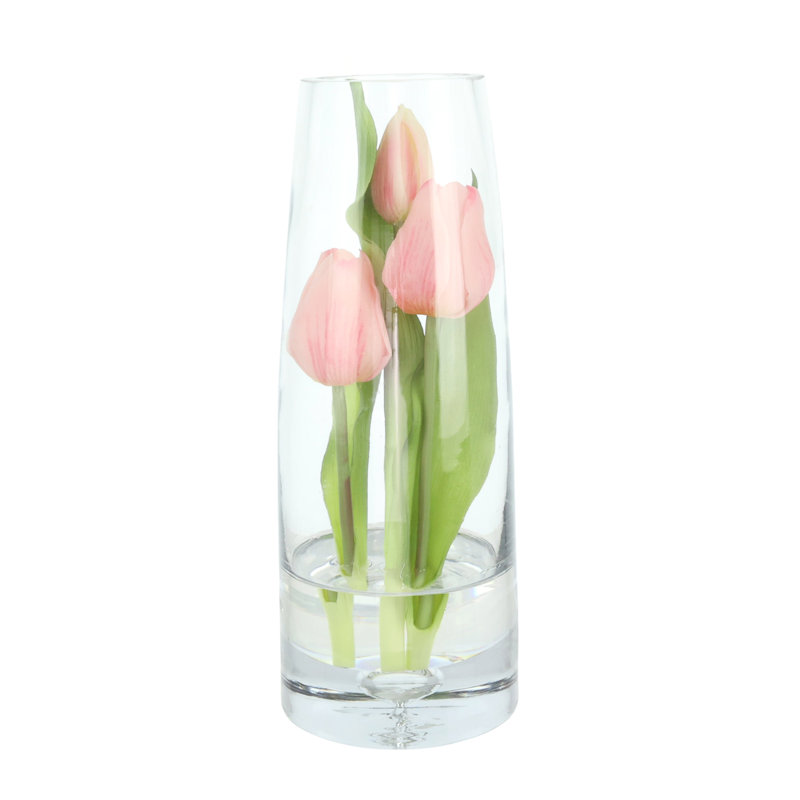 Tulipes disposées dans un vase en verre