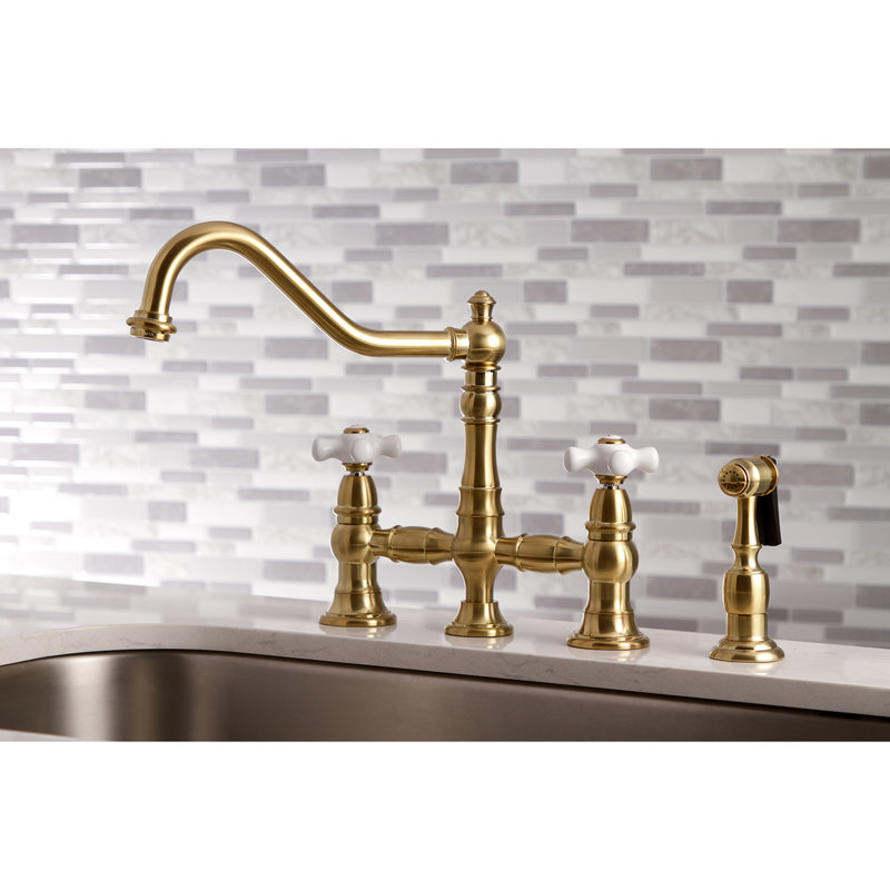 Kingston Brass Restoration Two-Handle 4-Hole Deck Mount Bridge Kitchen Faucet with Brass Side Sprayer, Satin Brass
