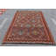 Tapis turc tissé à la main avec des tons chauds et des motifs géométriques complexes pour une pièce décorative riche et décorative