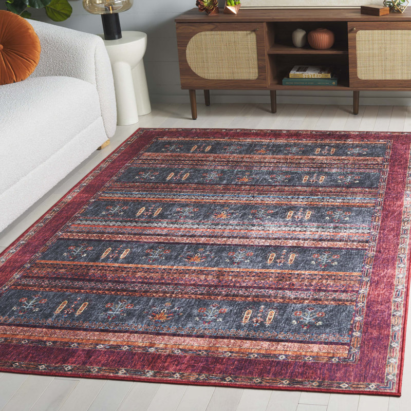 Tapis sud-ouest lavable à la machine en feutre / velours / film laminé Daveonte Orlando rouille / bleu