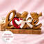 Art décoratif en bois fait à la main avec deux mots et symbole de l'amour