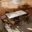 Table de salle à manger à piédestal en pierre frittée pour 6 personnes
