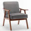 Fauteuil d'appoint en velours gris avec structure en bois, pour une ambiance accueillante. Construction robuste, s'intègre parfaitement dans une entrée.