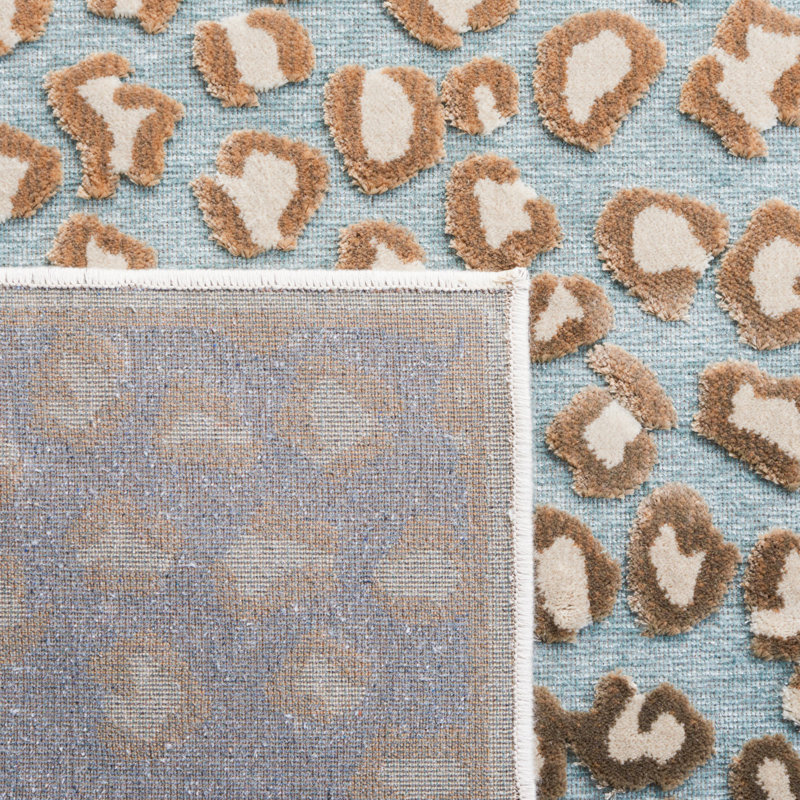 Banerjee Animal Print Area Rug in Stone/Aqua, Rectangle 5'3" x 7'6"