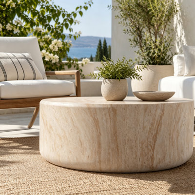 Table basse tambour en faux travertin discret