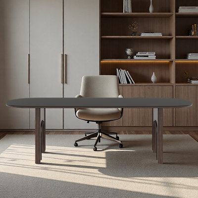 Bureau en granit noir mat avec une forme elliptique
