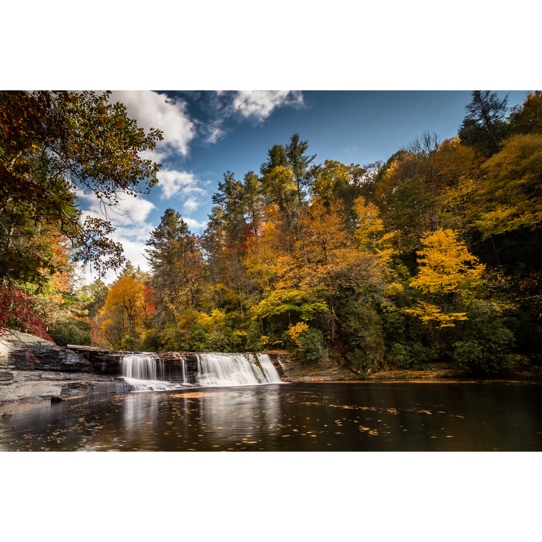 Leinwandbild Waterfall In A Forest In Fall Colors