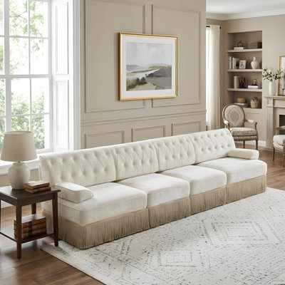 Floor-length fringe skirt design, Chesterfield-style sofa