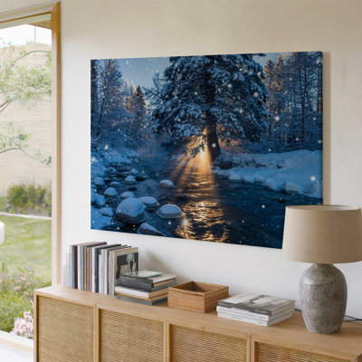 Canvas A Serene Winter Landscape At Dawn Featuring A Gently Flowing Wall Art River Surrounded By Snow Covered Banks And Large Frosted Canvas Wall Art