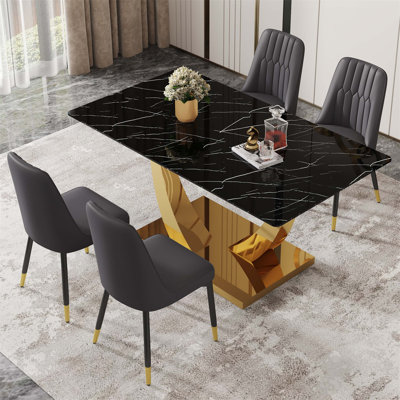 Table de salle à manger rectangulaire moderne avec plateau en verre trempé noir et pieds plaqués or, jumelée à des fauteuils confortables en polyuréthane