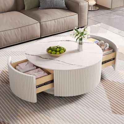 Table basse ronde moderne et fonctionnelle avec roulettes et deux tiroirs, idéale pour divers espaces de vie et décors