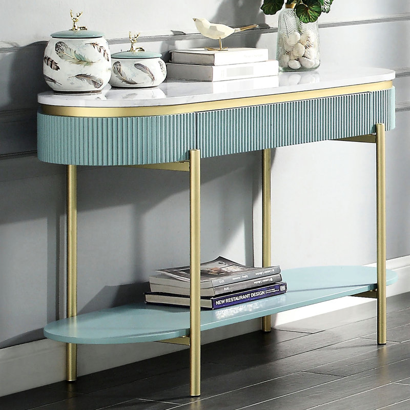 Bureau bleu sarcelle avec surface en faux marbre blanc et compartiment de rangement dissimulé