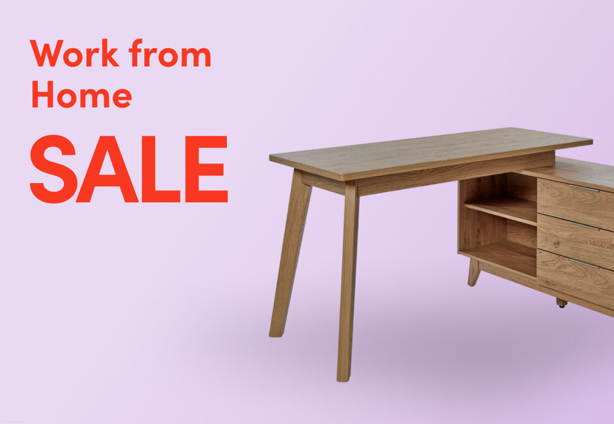 Work from Home Sale promotional banner featuring an oak desk with storage unit on a lavender background