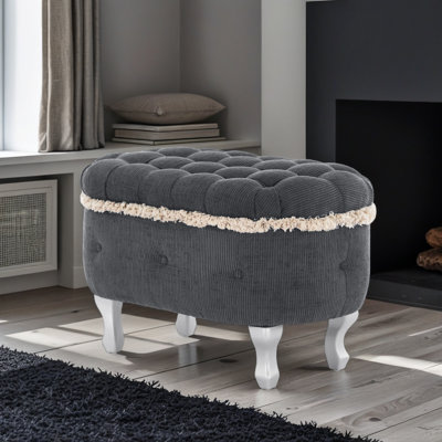 Banc de rangement capitonné avec bordure à pampilles et pieds en métal