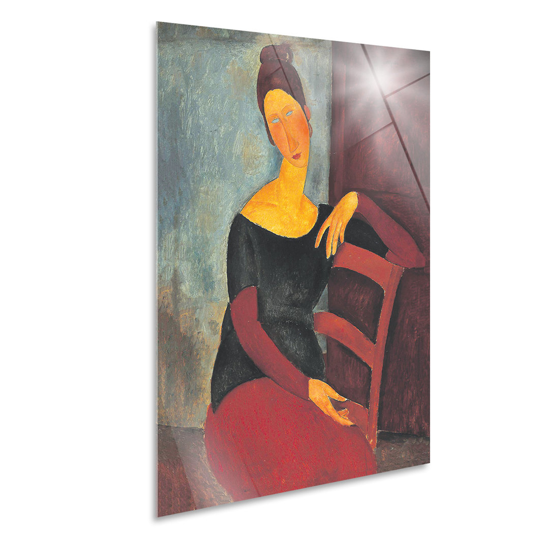 Wandbild Jeanne Hebuterne auf dem roten Stuhl von Amedeo Modigliani