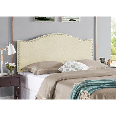 Tête de lit tapissier à garniture cloutée en tissu de lin, pieds en métal