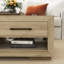 Table basse avec 4 tiroirs de rangement et tablette ouverte