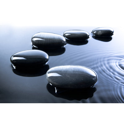 Black Pebbles In Water by Radarreklama - Wrapped Canvas Print