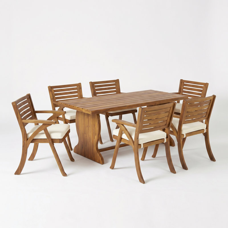 Ensemble de salle à manger d'extérieur Brizio pour 6 personnes, style bohème côtier, en bois d'acacia, avec fauteuils rembourrés, plateau à lattes et piètement à tréteaux.