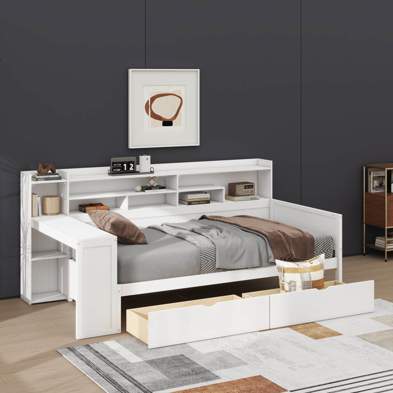 Lit de jour simple en bois avec rangement intégré, deux tiroirs et un bureau d'étude à côté pour une utilisation polyvalente