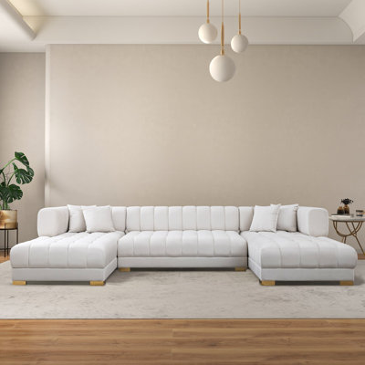 Canapé modulaire capitonné avec repose-pieds