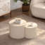 Table basse ronde avec un relief artisanal et un pied robuste, idéale pour les salons modernes et élégants-715684000-715684004