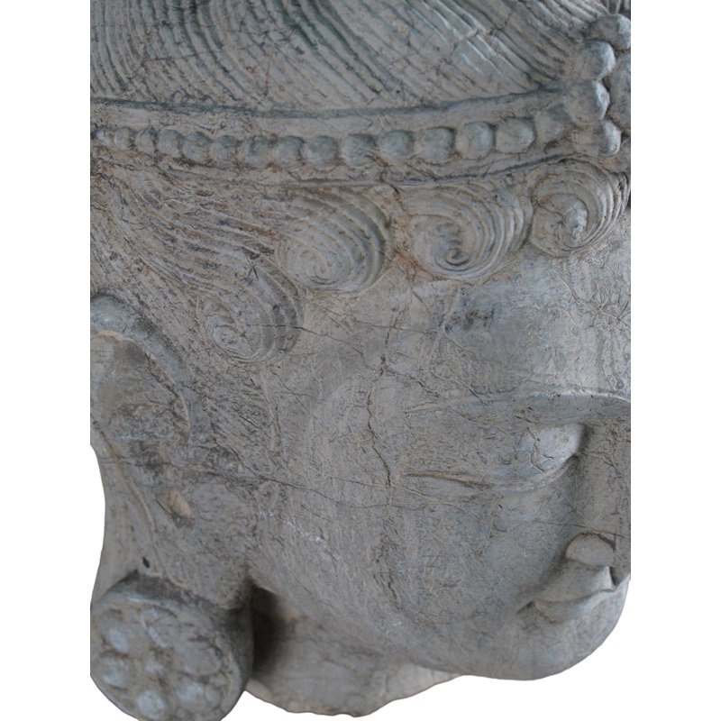 A Stone Statue Of Guanyin Head