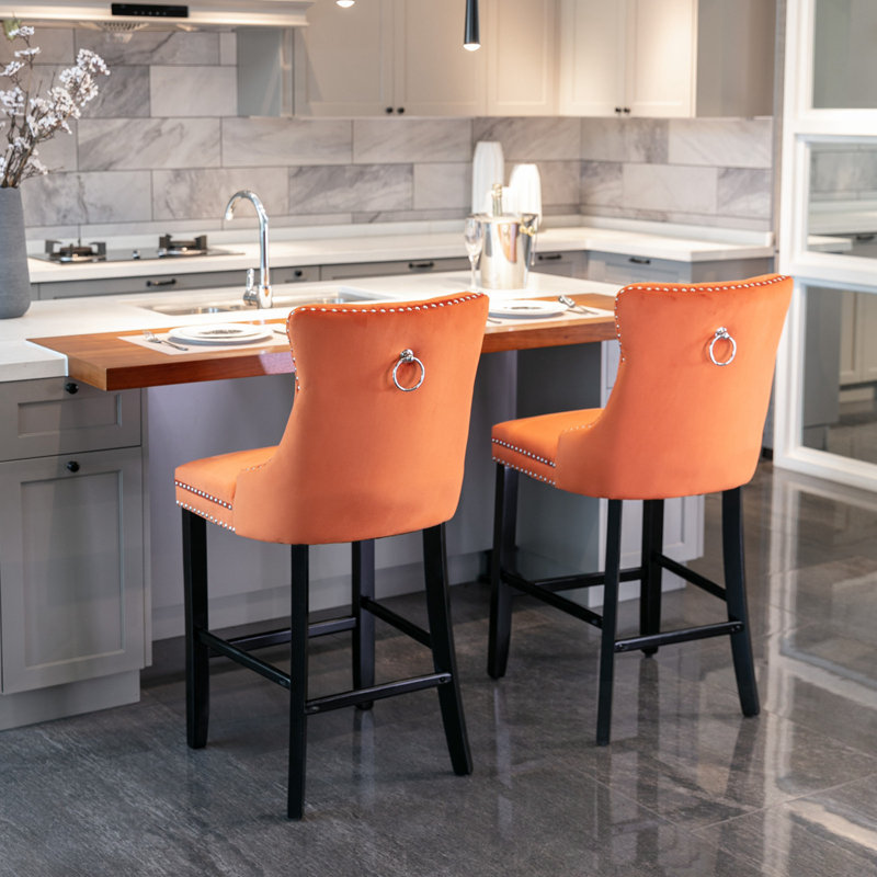 Ensemble de 2 tabourets de bar rembourrés en velours avec décoration capitonnée et pieds en bois, Orange