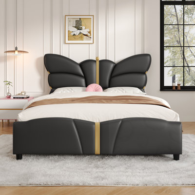Lit double tapissier avec tête et pied de lit en forme de papillon